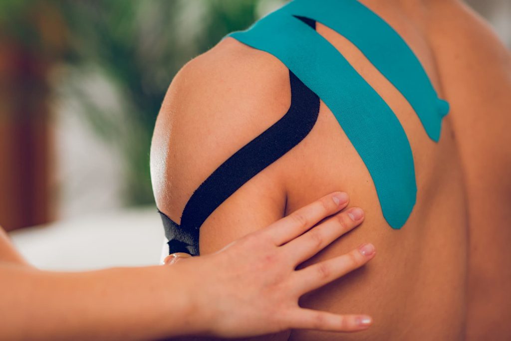 Shoulder treatment with kinesio tape