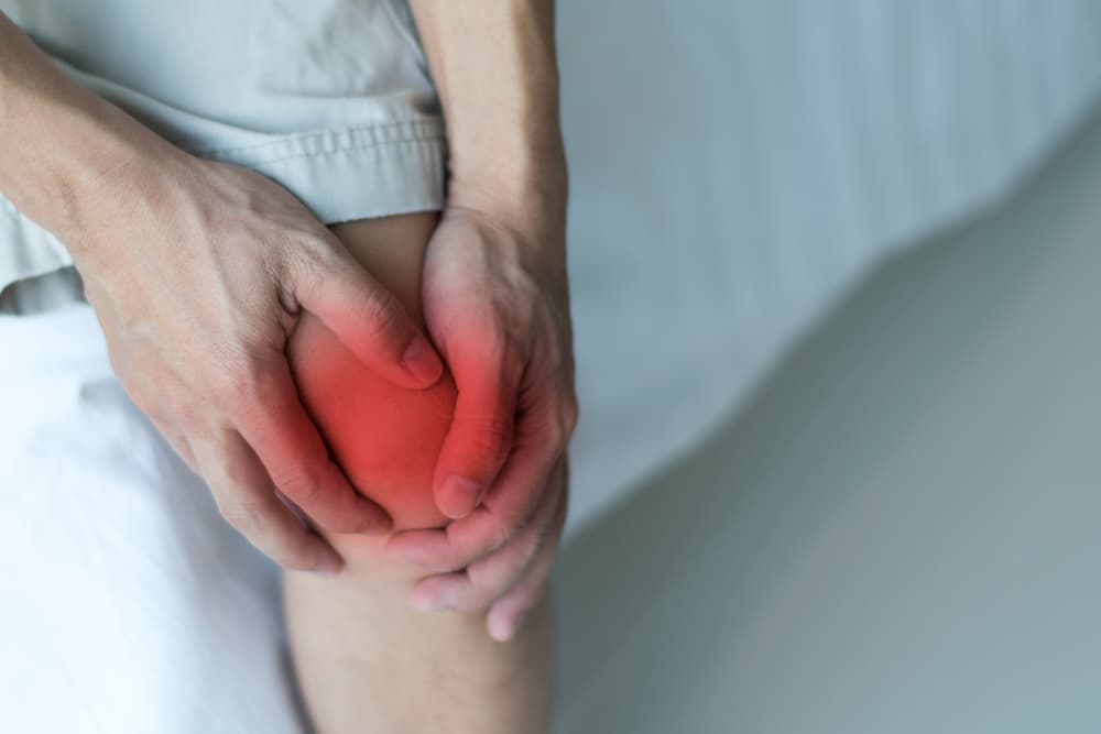 Man suffering from joint pain in knee